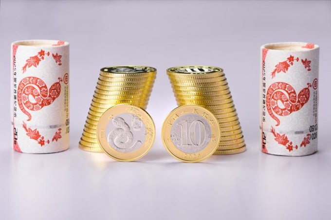 Cina: Pechino, emesse monete, banconote commemorative per Capodanno (3)